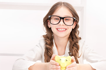 Image showing little girl with piggy bank