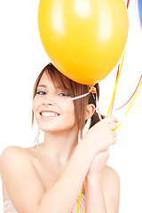 Image showing happy teenage girl with balloons