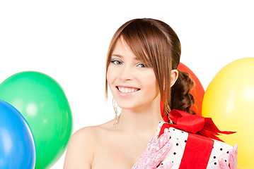 Image showing party girl with balloons and gift box