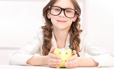 Image showing little girl with piggy bank