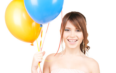 Image showing happy teenage girl with balloons