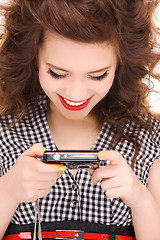 Image showing happy teenage girl with digital camera