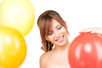 Image showing happy teenage girl with balloons