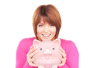 Image showing lovely woman with piggy bank  