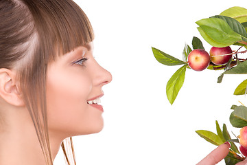 Image showing lovely woman with apple twig