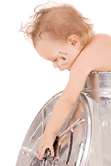 Image showing baby in trash can