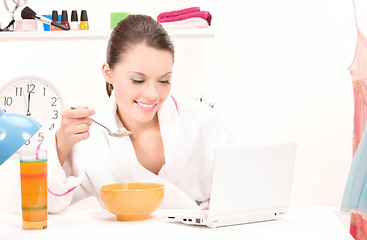 Image showing eating woman laptop computer