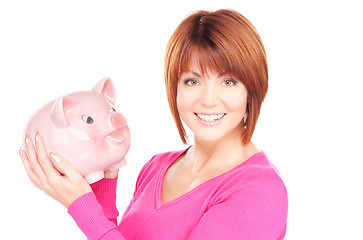 Image showing lovely woman with piggy bank  