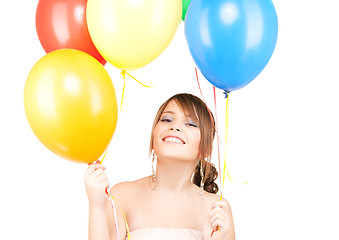 Image showing happy teenage girl with balloons