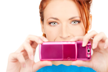 Image showing happy woman using phone camera