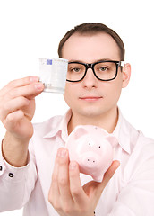 Image showing businessman with piggy bank and money