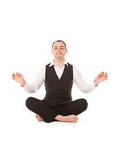 Image showing businessman sitting in lotus pose