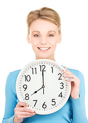 Image showing woman holding big clock