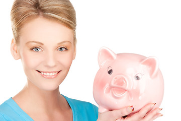 Image showing lovely woman with piggy bank