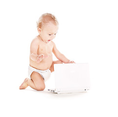 Image showing baby boy in diaper with laptop computer