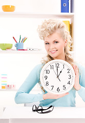 Image showing woman holding big clock