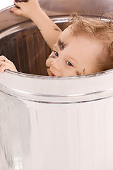 Image showing baby in trash can