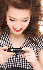 Image showing happy teenage girl with digital camera