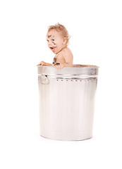 Image showing baby in trash can