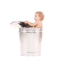 Image showing baby in trash can