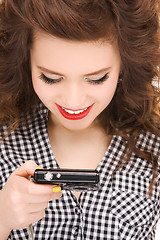 Image showing happy teenage girl with digital camera