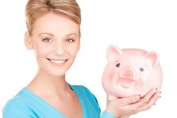 Image showing lovely woman with piggy bank