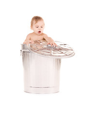 Image showing baby in trash can