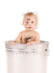 Image showing baby in trash can