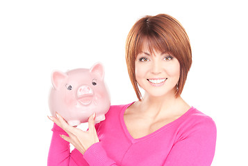 Image showing lovely woman with piggy bank  