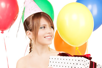 Image showing party girl with balloons and gift box