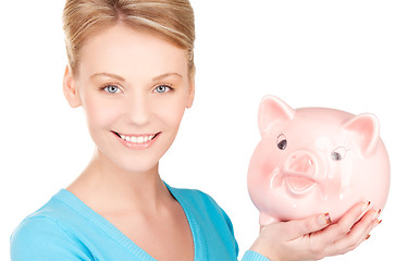 Image showing lovely woman with piggy bank