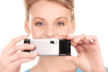 Image showing happy woman using phone camera