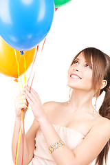 Image showing happy teenage girl with balloons