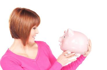 Image showing lovely woman with piggy bank  