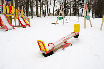 Image showing empty playground swing childhood snow winter 