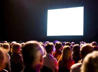 Image showing Crowd audience looking at screen