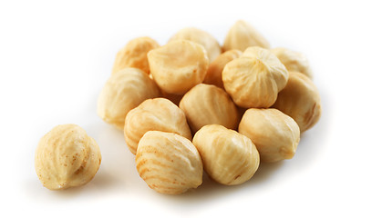 Image showing Closeup view of hazelnuts over white background