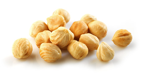 Image showing Closeup view of hazelnuts over white background