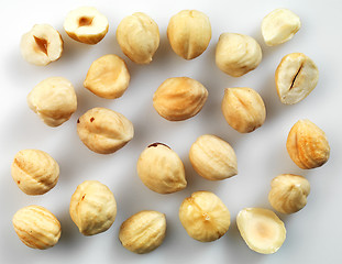 Image showing Closeup view of hazelnuts over white background