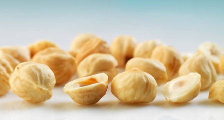 Image showing Closeup view of hazelnuts over white background