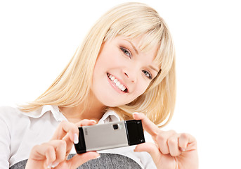 Image showing happy woman using phone camera