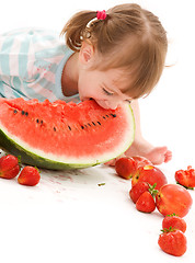 Image showing little girl with strawberry and watermelon