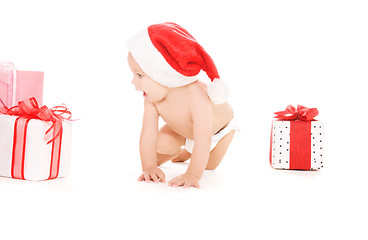 Image showing santa helper baby with christmas gifts