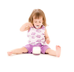 Image showing little girl with yogurt