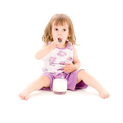 Image showing little girl with yogurt