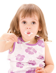 Image showing little girl with yogurt