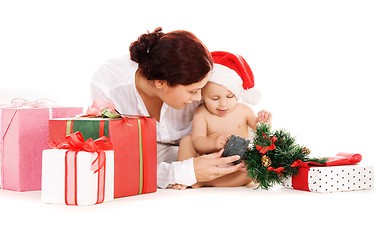 Image showing baby and mother with christmas gifts