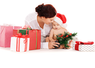 Image showing baby and mother with christmas gifts