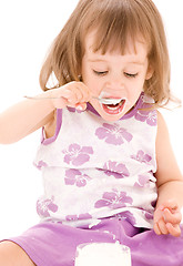 Image showing little girl with yogurt