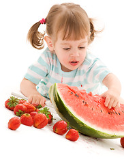 Image showing little girl with strawberry and watermelon